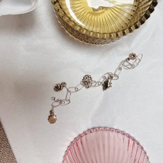 Brass and silver charm bracelet
