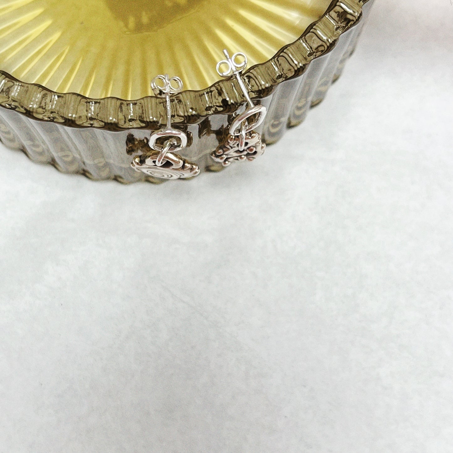 Brass and silver charm studs